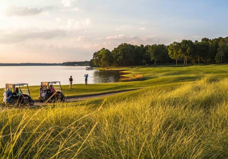 people playing golf on the banks of Lake Oconee